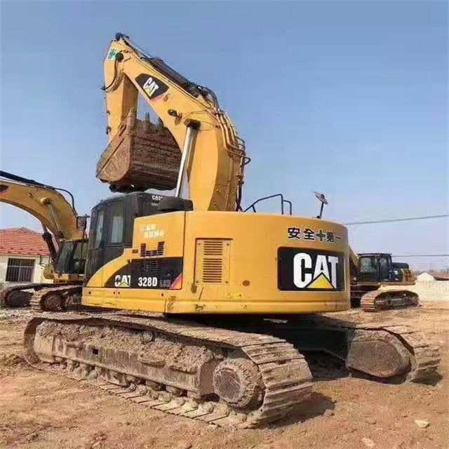 34.7 tonnellate pronte per il lavoro e giapponese Caterpillar 328 D in buone condizioni.