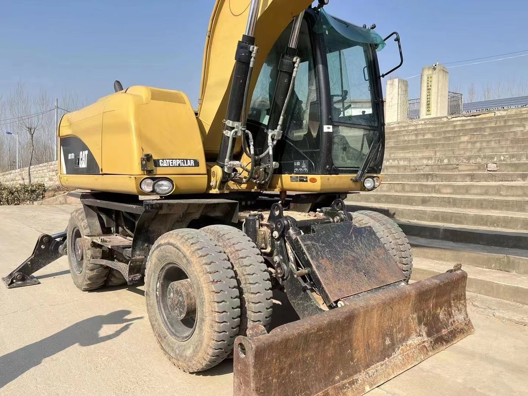 90% Caterpillar M317D2 Escavatore a ruote usato di alta qualità e migliori prestazioni in vendita
